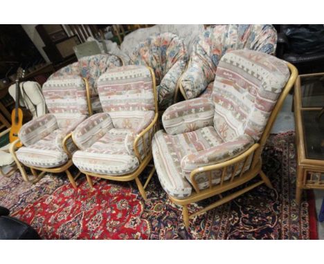 Three Ercol pale beech armchairs with cushion back, seats & arms