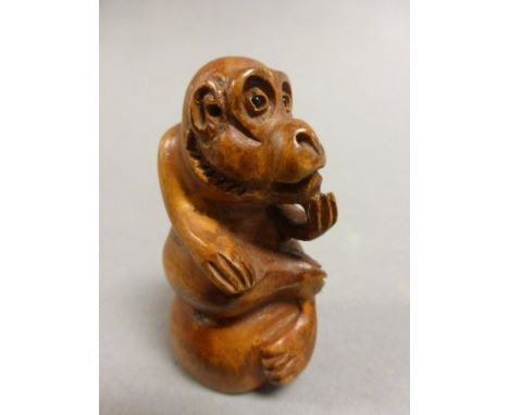 Signed wood netsuke of a monkey
