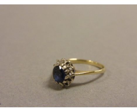 9ct Gold Ring with a Sapphire and Diamonds (some diamonds missing)