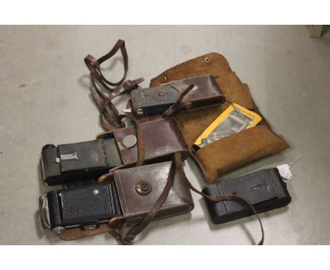 Five cased vintage cameras to include Kodak
