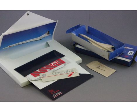 Concorde Flights of Fantasy folder with contents and a boxed model of Concorde and stick pin