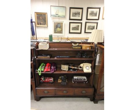 Antique mahogany waterfall bookcase with three drawers to base on bracket feet