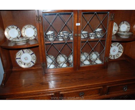 A Noritake Teaset for twelve including cups and saucer, two bread and butter plates, milk jug and sugar bowl, in gold and rim