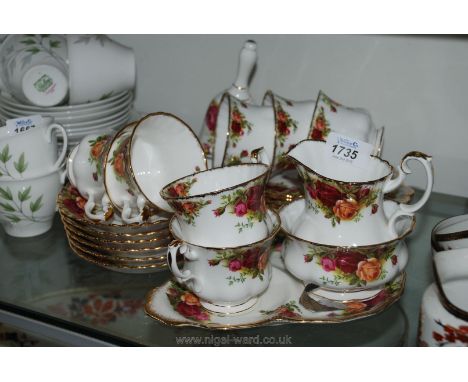 A quantity of Royal Albert 'Old Country Roses' including a bell, seven cups (one with chip to rim), six saucers, five tea pla