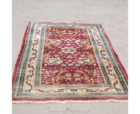 A vintage Persian Rug with purple ground, bird motifs and multiple borders, 75" long x 48" wide
