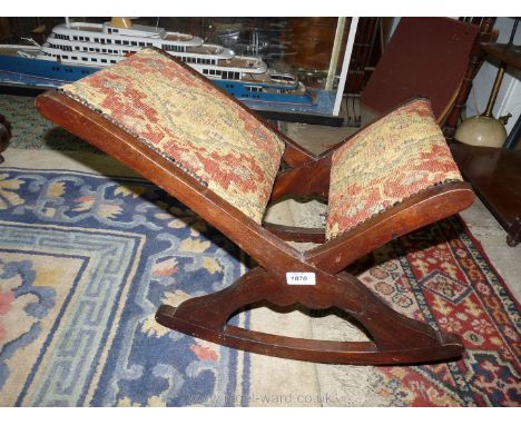 An Edwardian Beech framed Gout Stool, of "X" form with tapestry pattern floral upholstery