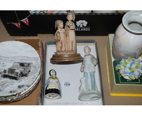 Three china ornaments including a Welsh lady, a Nao style boy with a lamb at foot and a figure of two children ready for bed 