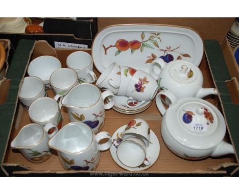 A Royal Worcester 'Evesham' part Teaset including two teapots, three graduated milk jugs, sandwich platter, sugar bowl, three