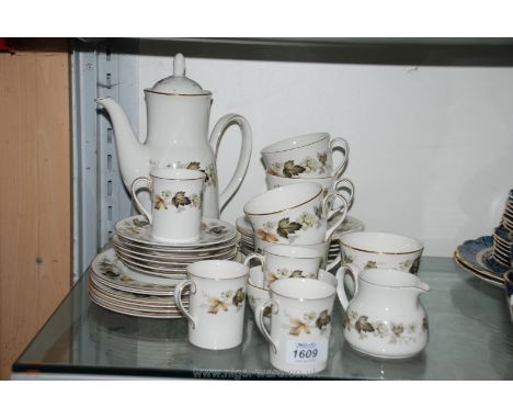 A part 'Larchmont' pattern Tea and coffee set by Royal Doulton including various cups, coffee cans, saucers, tea plates and a