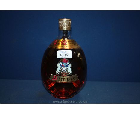 A twelve year old bottle of de luxe Scotch Whisky Dimple by John Haig & Co Ltd.