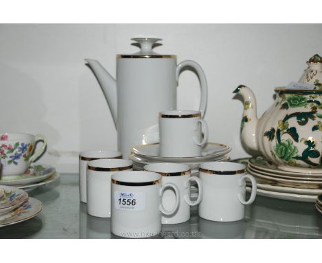 A Thomas of Germany part Coffee Set including six cups and saucers and a Coffee Pot with gold rim decoration