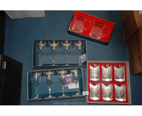 A box of six cut glass crystal glasses, two lead crystal tankards and two boxes of four wine glasses