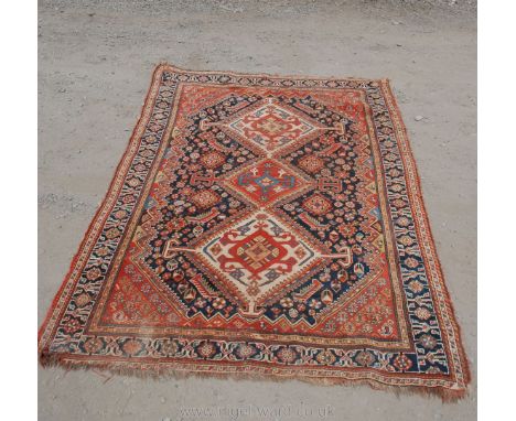 A vintage Persian Rug with three geometric medallions and borders, 82" long x 47" wide
