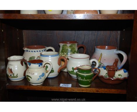 A quantity of Torquay ware including jugs and a chamber stick (some a/f)