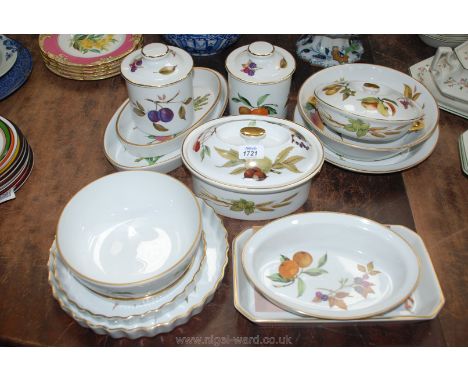 A quantity of Royal Worcester 'Evesham' tableware including two flan dishes, oval casserole dish, fruit bowl, two storage jar