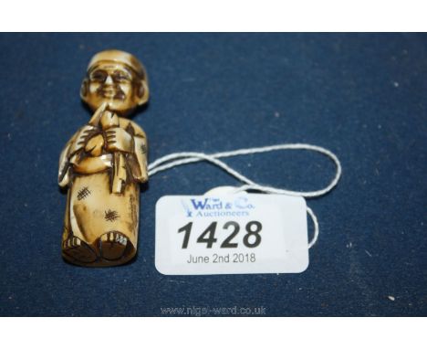A signed nodding and turning head Ivory Netsuke of an oriental scholar, signed under the right foot, dating from the early 19