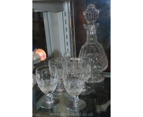 A Waterford crystal Decanter with stopper and five Waterford crystal glass wine Glasses