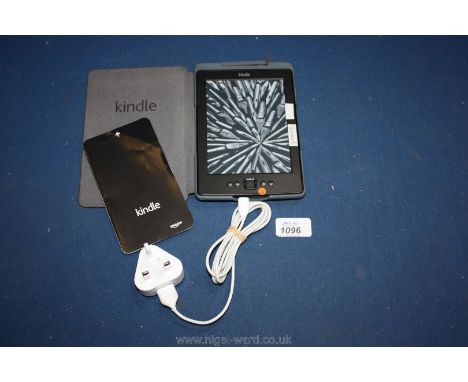 An Amazon Kindle eReader model D0110 with original case with built-in light, charging cable and mains charger.
