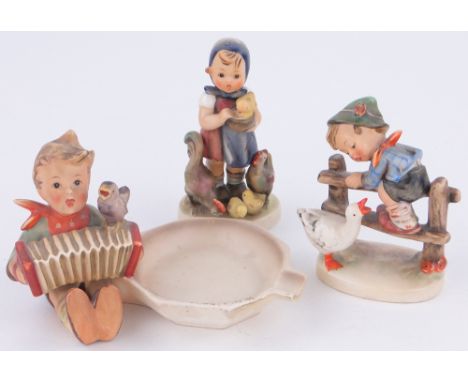 A Goebel's Hummel figure girl with chickens,
height 4.25", a Hummel dish with boy accordion player and another, (3).