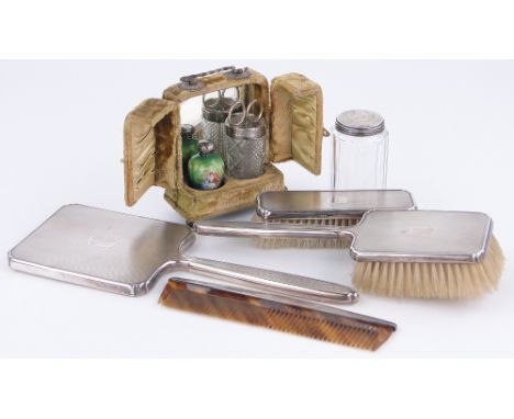 A group of various items,
including silver backed brush and mirror set, silver topped porcelain perfume bottle, etc.