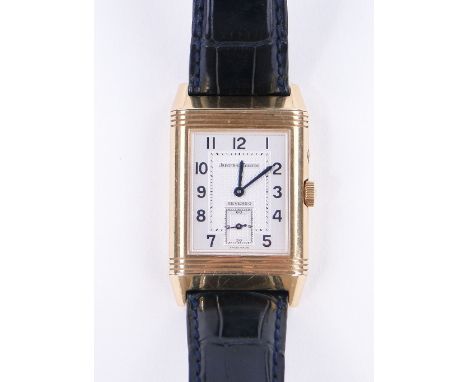 A gent's Jaeger LeCoultre Reverso day and night wristwatch,
18ct gold case with alligator strap and deployant 18ct gold buckl