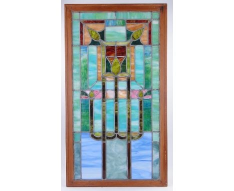 A pair of Mexican stained lead light glass windows from an Art Deco house in Florida,
framed, height 48.5" overall.(des chang