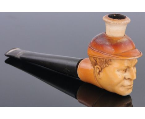 A carved Meerschaum pipe in the form of Babe Ruth,
length 4.5", bowl height 2".