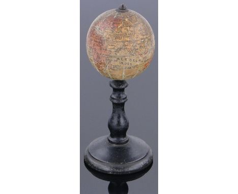 A miniature 19th century French terrestrial globe,
on turned ebonised wood stand, diameter 2", overall height 5".