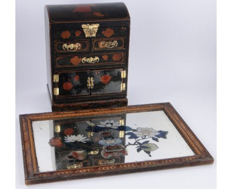 An Oriental lacquered domed top cabinet,
with painted decoration, height 18.5", and a painted wall mirror, (2).