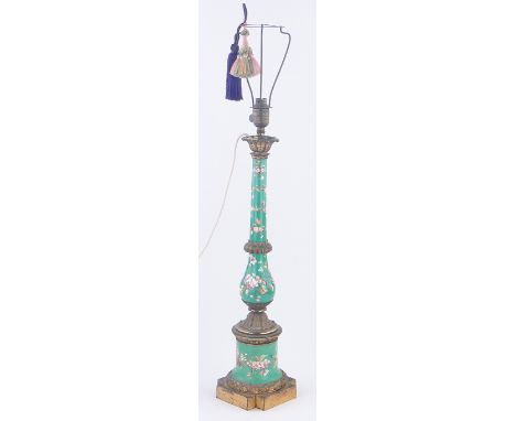 A 19th century ormolu and porcelain table lamp,
with painted bands of flowers and cast mounts, height excluding light fitting