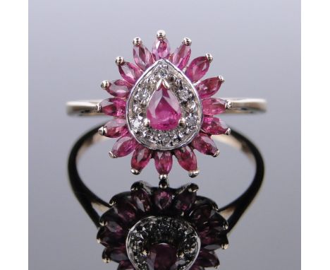 A 9ct gold ruby and diamond cluster ring,
setting height 14mm, size R.