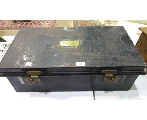 A japanned metal military storage box labelled R Connell Surgeon RN, Bilney &amp; Co. Outfitters, Portsea, 64cm wide and a pi