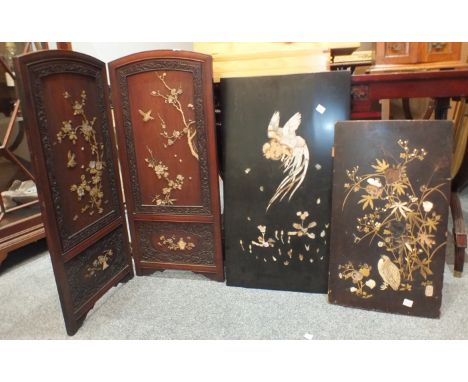 A Japanese two-fold fire screen inlaid with birds, two inlaid wood panels and various African carved figures.