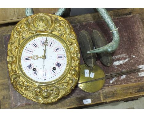 A 19th century French wall clock with enamelled convex dial and brass bob pendulum, striking on a gong.