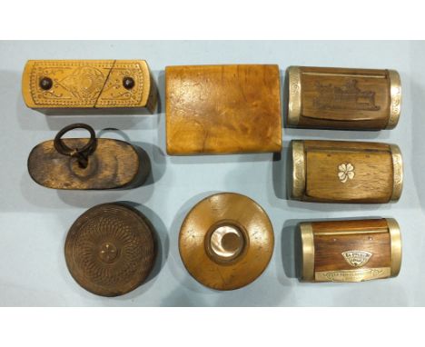 A wooden puzzle snuff box and seven other wooden snuff boxes.