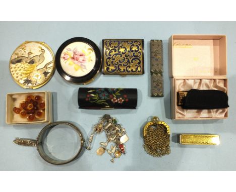 A silver hinged bangle, a silver charm bracelet, three compacts and other items.