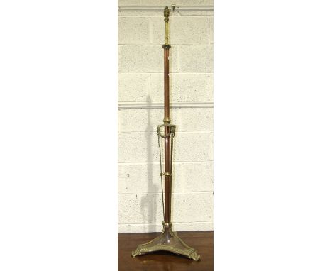 A copper and brass adjustable lamp standard, 200cm high, (extended) and a small embossed brass-framed mirror fitted with thre