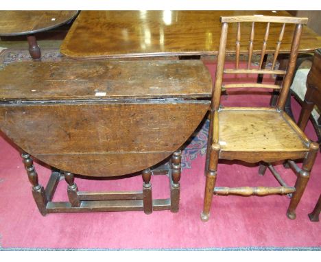 A small antique oak gate leg table with oval drop leaves on tuned legs, 93 x 106cm and a country-made wood-seat chair, (2).