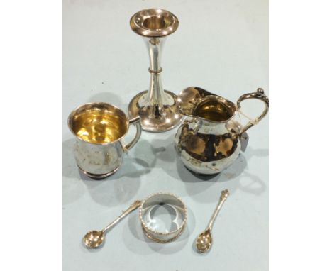 A silver christening mug, Birmingham 1938, (damaged), a loaded silver candlestick and other small silver.