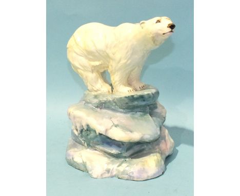A 20th century ceramic sculpture of a polar bear standing on an ice floe, monogram and impressed R Thompson to base, 19cm hig