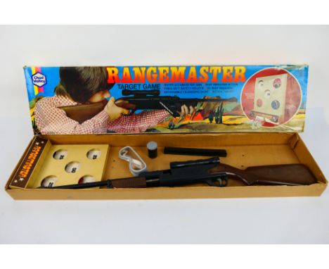 Chad Valley - A boxed vintage Rangemaster target game # 22000. The gun and accessories appear in Good condition, the box is F