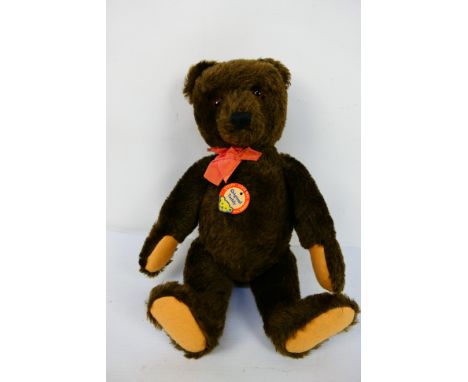 Steiff - An unboxed Steiff Original Marke, Original Teddy with faded red dicky bow in brown mohair. Stitched nose and paws, j