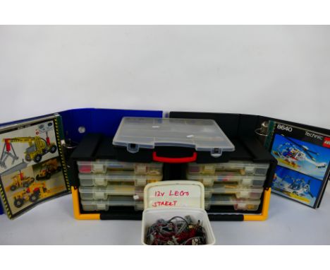 Lego - A quantity of playworn Lego housed in two 4 tray container cases, a compartment case, and plastic tub. The lot is acco