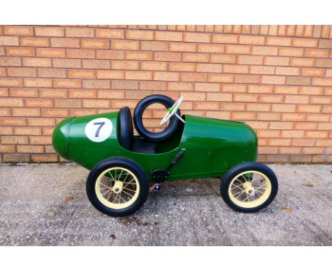 Tri-ang - A vintage steel bodied 1950s Tri-ang Racer Super Eight pedal car. The model has been restored at some point and app