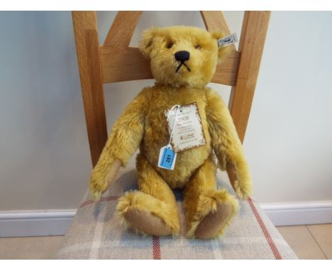 Steiff - a 1908 replica Teddy Bear with growler, blonde mohair, issued in a limited edition of 3000, button and tag to the ea