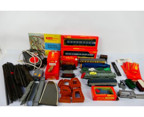 Triang - A group of mainly unboxed Triang OO gauge model railway items that contains, locomotives, rolling stock, and accesso