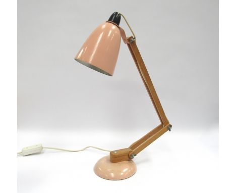 A Mac lamp with pink shade and base 