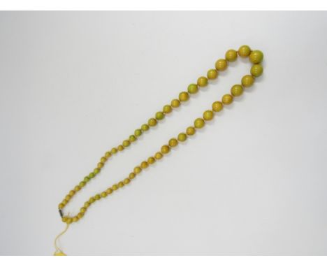 Vintage graduated bakelite/ plastic necklace in toned melon coluring, with hand knotting between each bead 