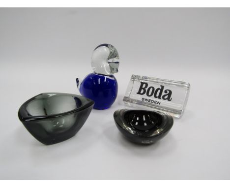 A collection of art glass including Kaj Franck chestnut dish, Dansk tea light holder. Boda display sign and blue glass bird. 