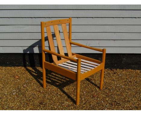 A modern Ercol armchair with slat back, no cushions 